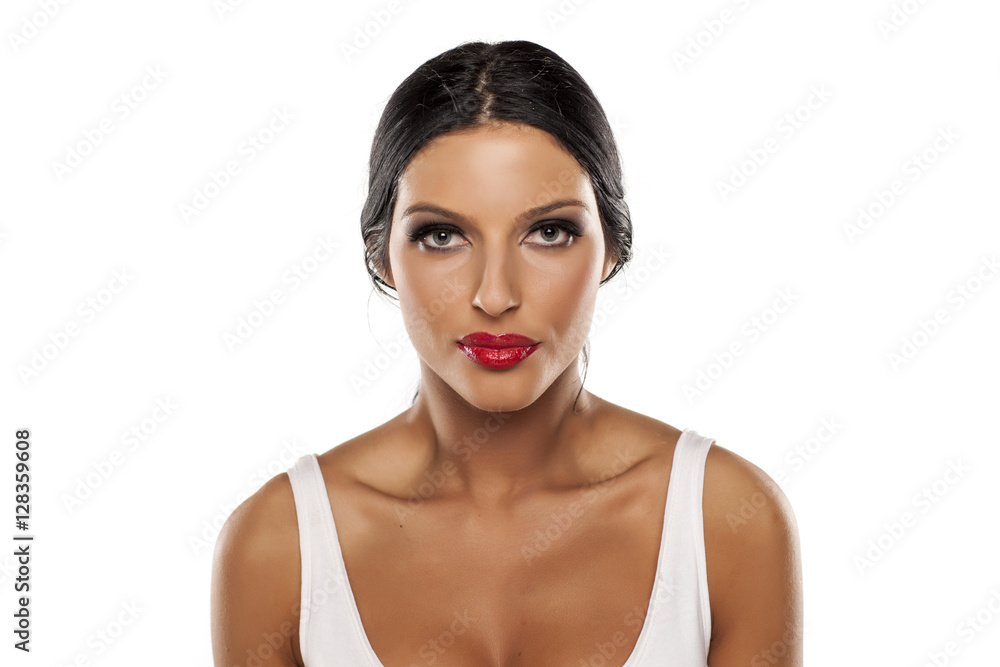 beautiful young woman with tied hair and blue eyes on a white background beautiful young woman with tied hair and blue eyes on a white background