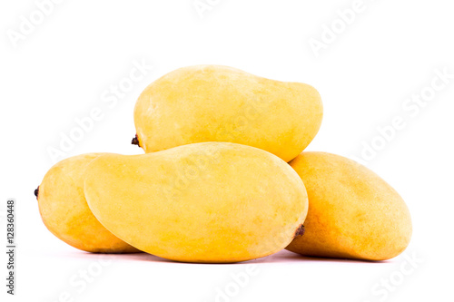 a pile yellow sweet ripe mangos on white background healthy fruit food isolated 