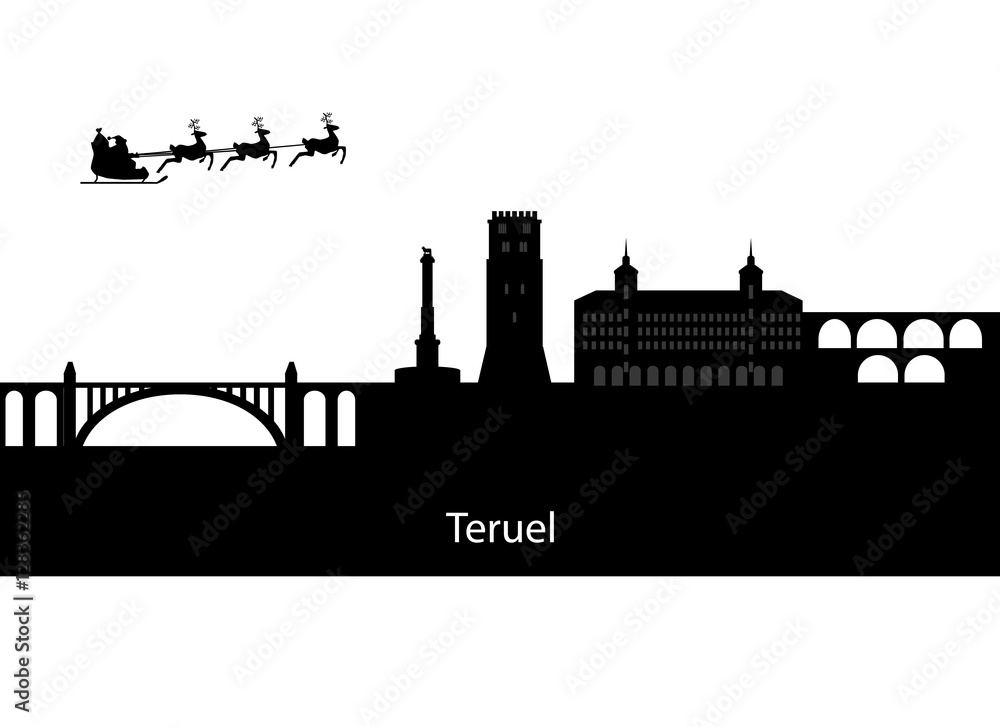 Santa claus flying over skyline of teruel in spain