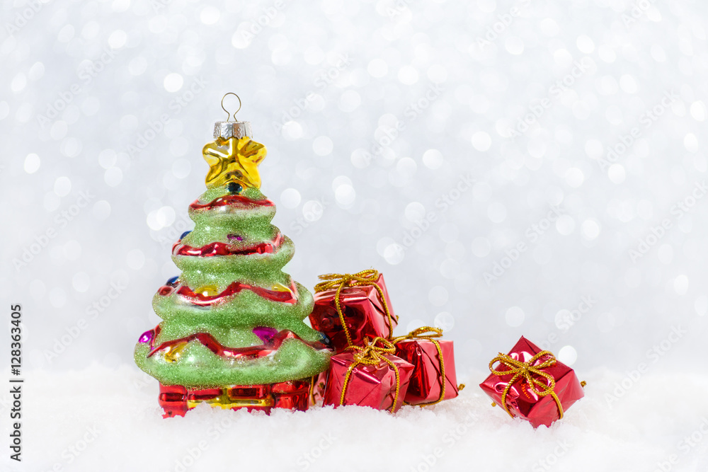 christmas card with tree and gifts in snow, bokeh christmas card with tree and gifts in snow, bokeh