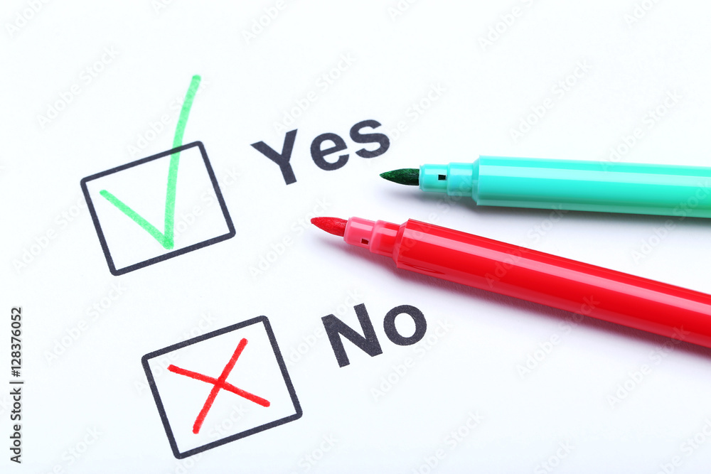 Check boxes yes and no on white paper Check boxes yes and no on white paper