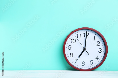 Wallpaper Mural Red round clock on a mint background Torontodigital.ca