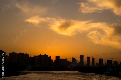 Beautiful sunset over the Yellow River, Lanzhou, China © Postcardfromearth