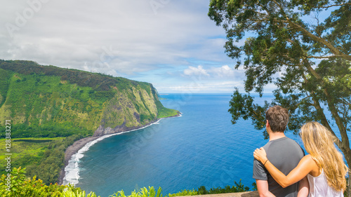 Young couple enjoying the amazing view in Waipio Valley, Big Island, Hawaii, Usa photo