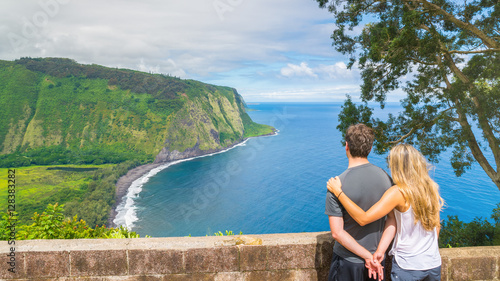 Young couple enjoying the amazing view in Waipio Valley, Big Island, Hawaii, Usa photo