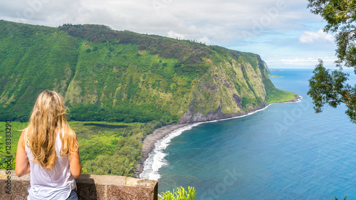 Young woman enjoying the amazing view in Waipio Valley, Big Island, Hawaii, Usa