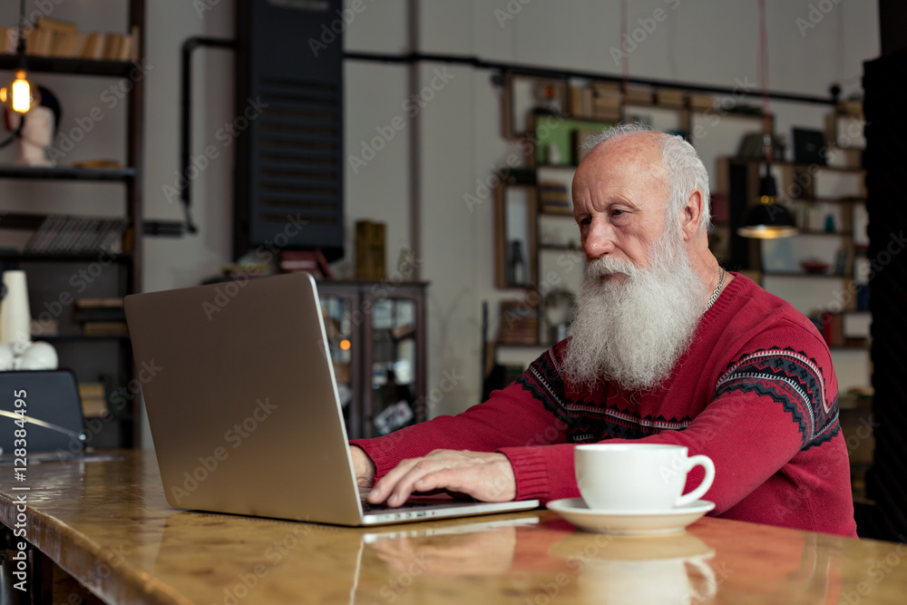 old man with a laptop