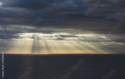 Clouds blue sky and sunlight sunset on horizon ocean .   loudscape on background seascape dramatic atmosphere rays sunrise. Relax view waves sea  mockup nature evening concept.