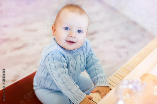 cute laughing baby playing the piano