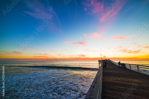 Fototapeta Naklejka Na Ścianę i Meble -  Wooden pier in Pacific Beach at sunset