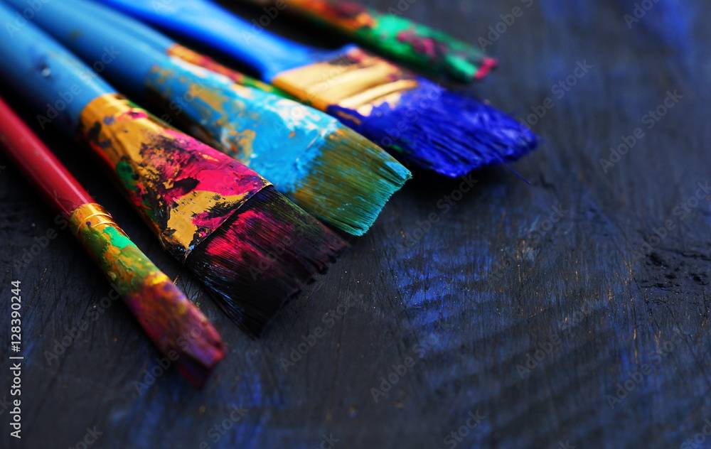 Fototapeta premium paintbrushes in dark background