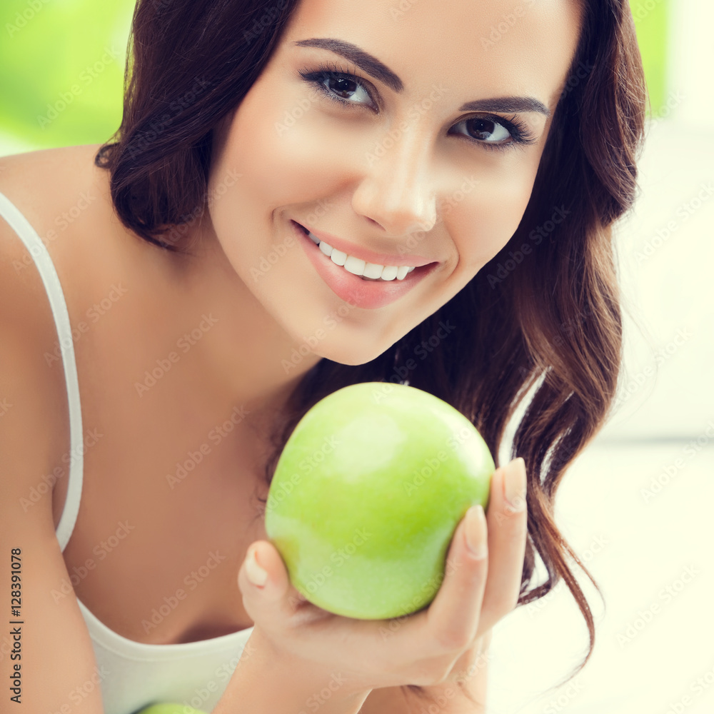 Young smiling woman with green apples Young smiling woman with green apples