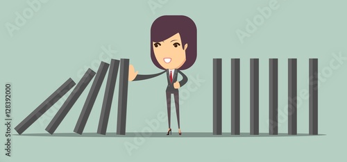 Man stopping the domino effect with falling dominoes