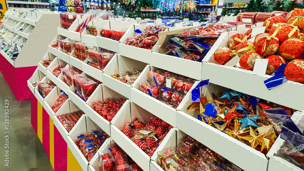 Fototapeta premium Colored Christmas toys in store. decorations.