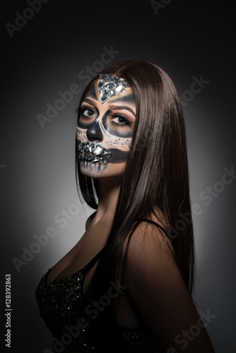 Santa Muerte. Pretty young woman with face art