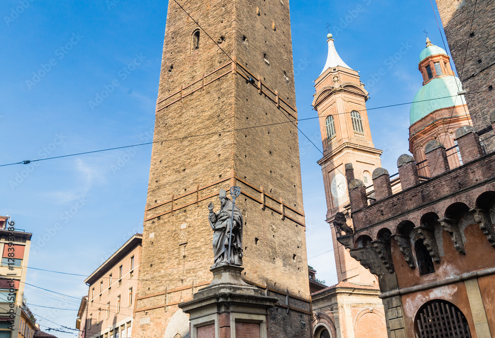 Statue of Bishop St. Petronius, Garisenda tower. Bologna, Italy