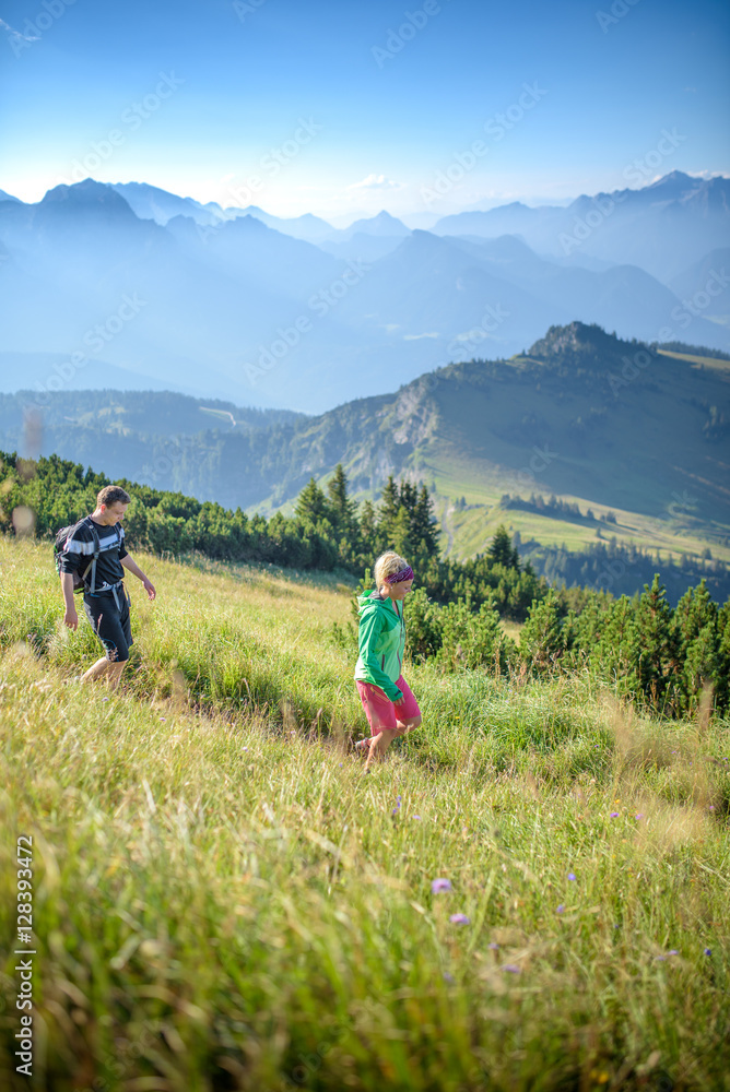 Young couple hiking, Austrian alps