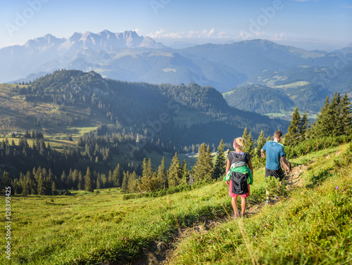 Young couple hiking, Austrian alps