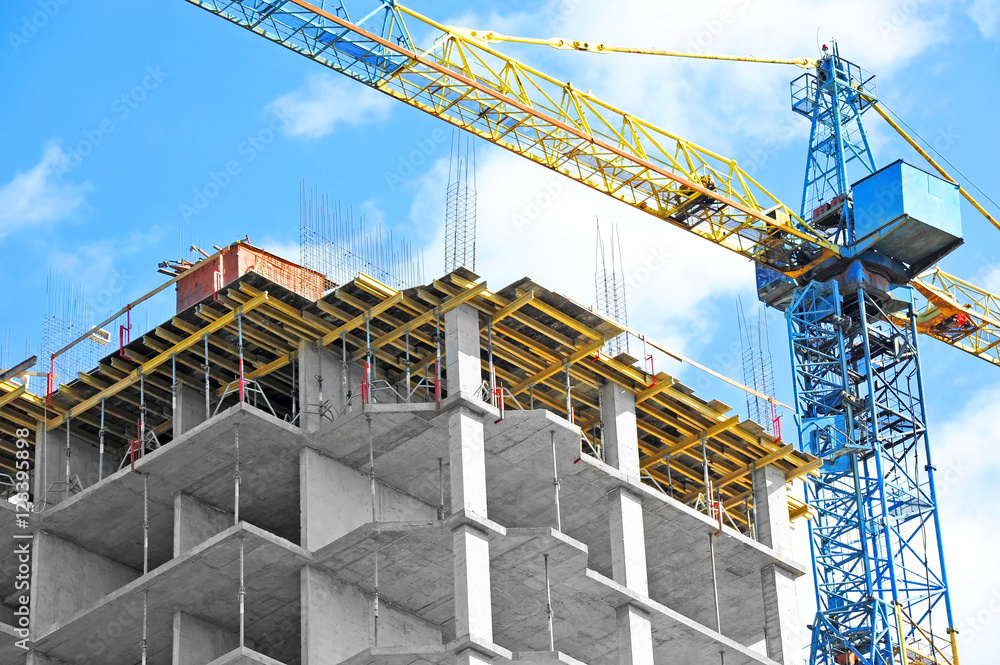 Crane and highrise construction site Crane and highrise construction site
