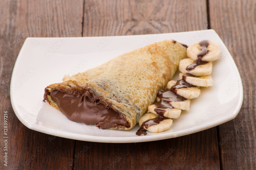 Crepes with chocolate cream and banana Crepes with chocolate cream and banana