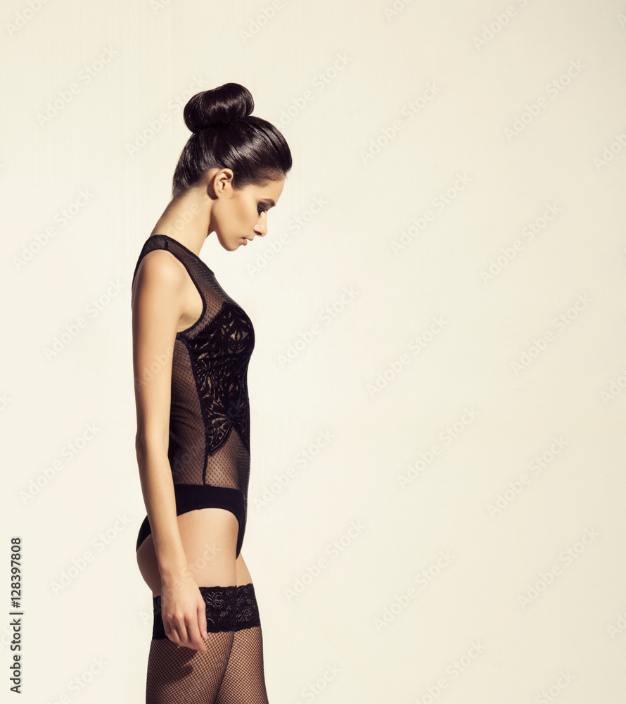Fototapeta premium Young brunette woman in white erotic lingerie