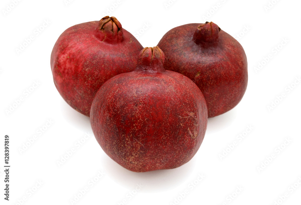 three pomegranates fruit isolated on white background three pomegranates fruit isolated on white background