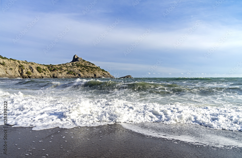 Strong surf on a sandy beach. Crimea.