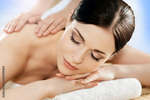 Portrait of a young woman relaxing on a massage