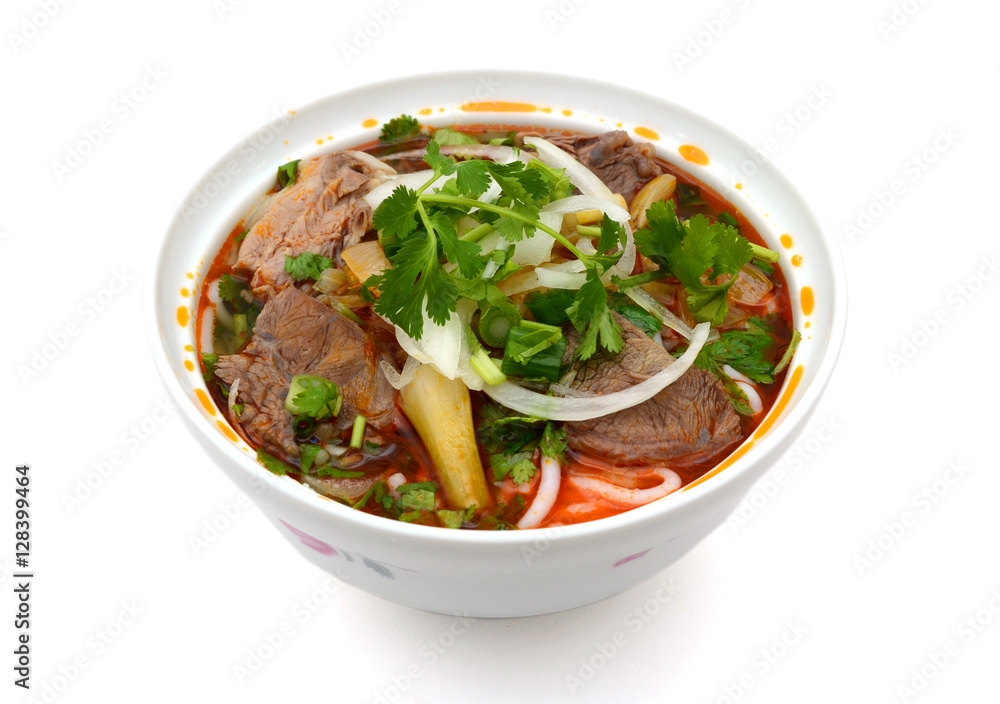 Bun Ho Hue or Vietnamese vermicelli noodles with beef on a white background Bun Ho Hue or Vietnamese vermicelli noodles with beef on a white background