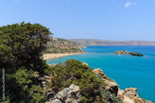 Lagoon with blue water and sandy beach at eastern part of Crete island © gorelovs