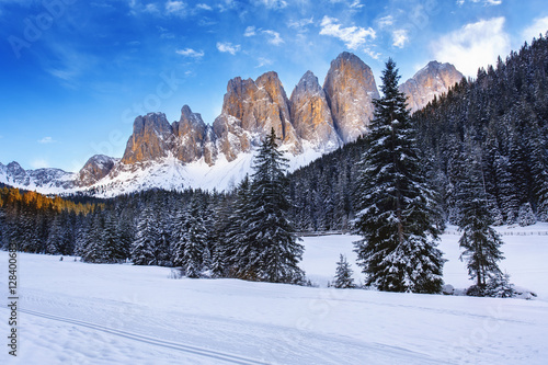 Winter views of the Geisler or Odle Dolomites mountain peaks in the Val di Funes (Villnosstal) in Italy. The surroundings of the village Santa Maddalena. Beautiful places for nordic ski. photo