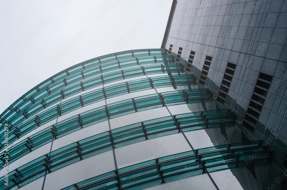 Obraz premium Business centre abstract architecture glass perspective view. Sky background.