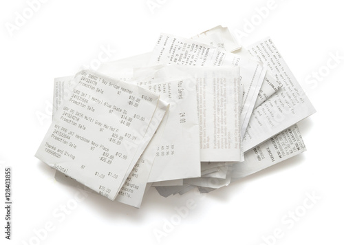 Pile of shopping receipts on white background photo