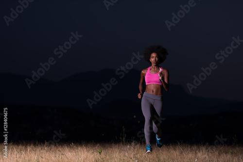 Young African american woman jogging in nature © .shock