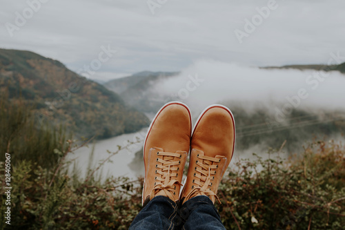 boots in the foreground on the panoramic view of the Valley, concept of adventure and travel