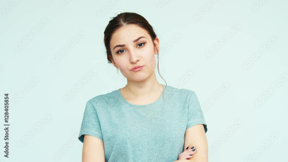 Arrogantly. Portrait cute girl teenager 14 years old on white background looking at camera Arrogantly. Portrait cute girl teenager 14 years old on white background looking at camera