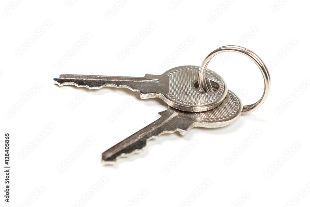 Two silver keys isolated on white background Two silver keys isolated on white background