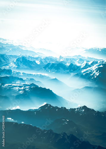 Mountain peak. landscape with peaks covered by snow and clouds