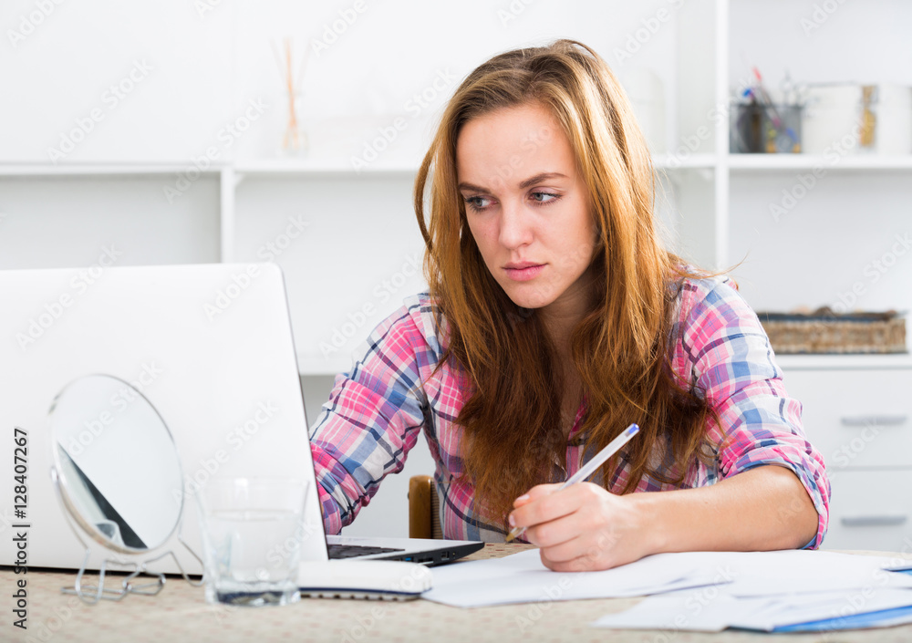 sad girl working on laptop