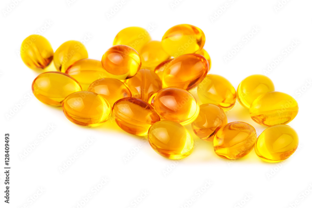 Vitamin E capsules on white closeup Vitamin E capsules on white closeup