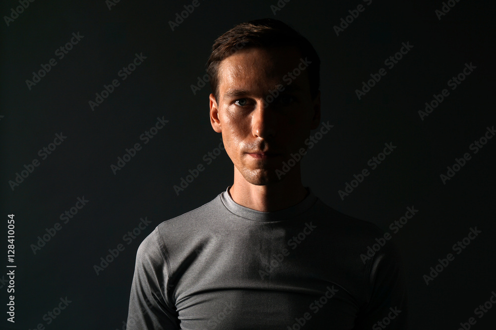 Young man in t-shirt on gray background. Young man in t-shirt on gray background.