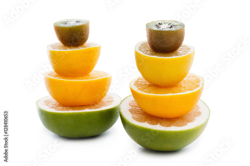 Slices citrus fruits on whi...