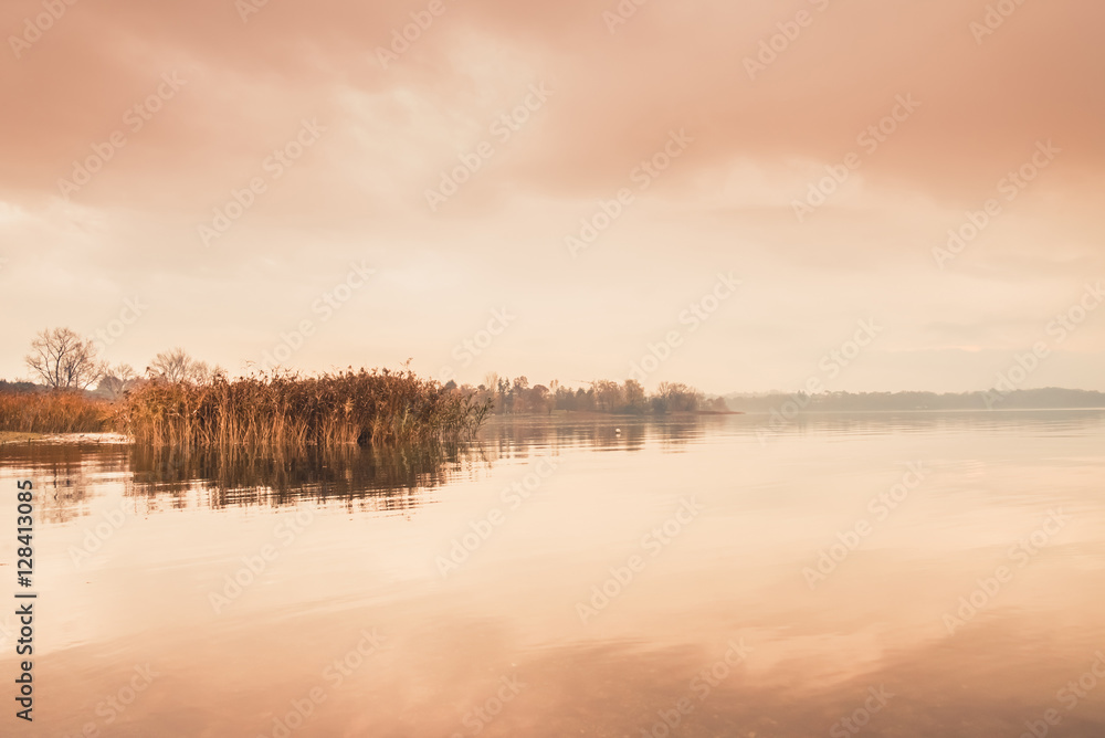 Sunrise on the quiet lake and reeds Sunrise on the quiet lake and reeds