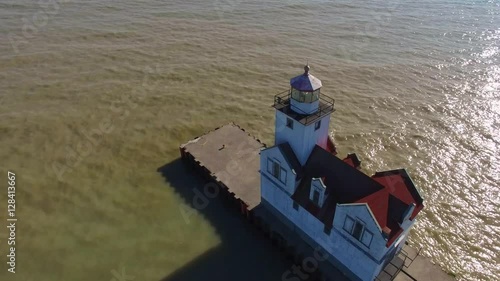 Scenic Flyover of Lighthouse on Lake Michigan.
 photo