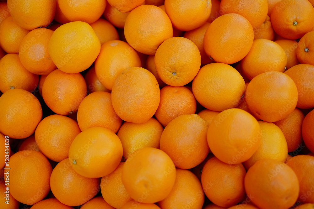 Tangerines background. Fresh oranges on market. Healthy fruits.