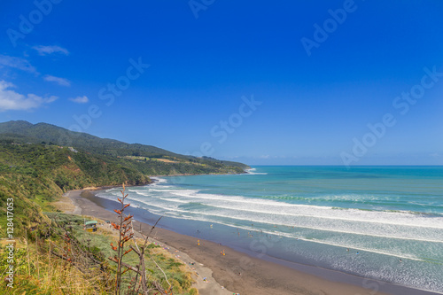 Sunny summer view of Ngarunui surfers beach, near Raglan, Waikato, New Zealand