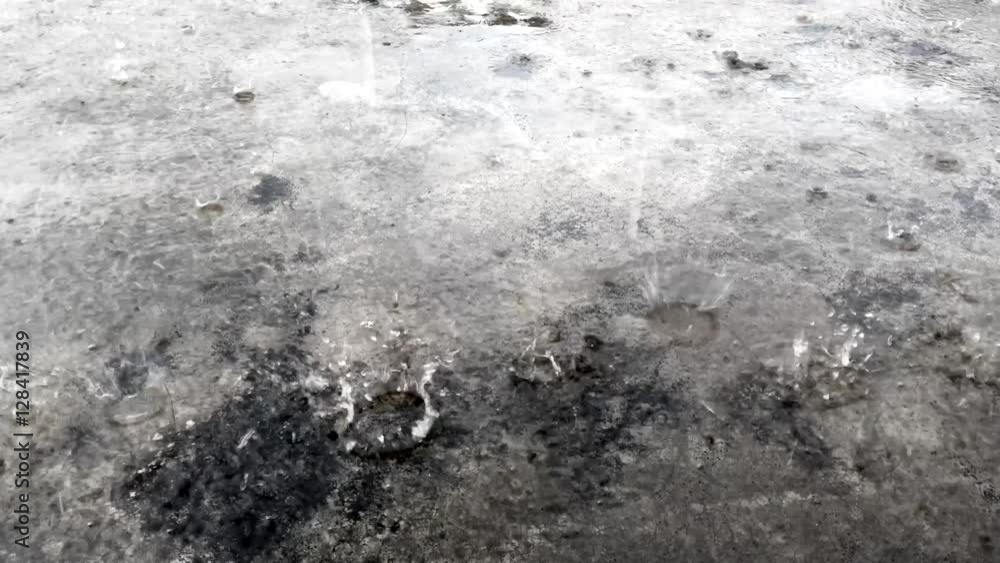 Rain falling on old grunge concrete floor Rain falling on old grunge concrete floor