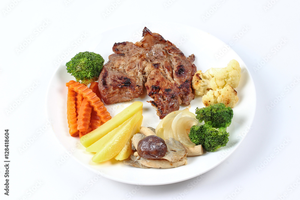 Home made ,Pork steak and mixed vegetables served. Home made ,Pork steak and mixed vegetables served.