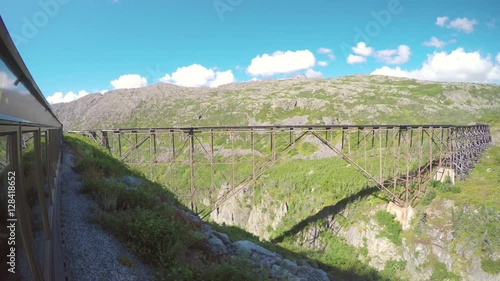 White Pass and Yukon Route Railroad Scenic Train Ride Passing Old Wooden Bridge Not In Use