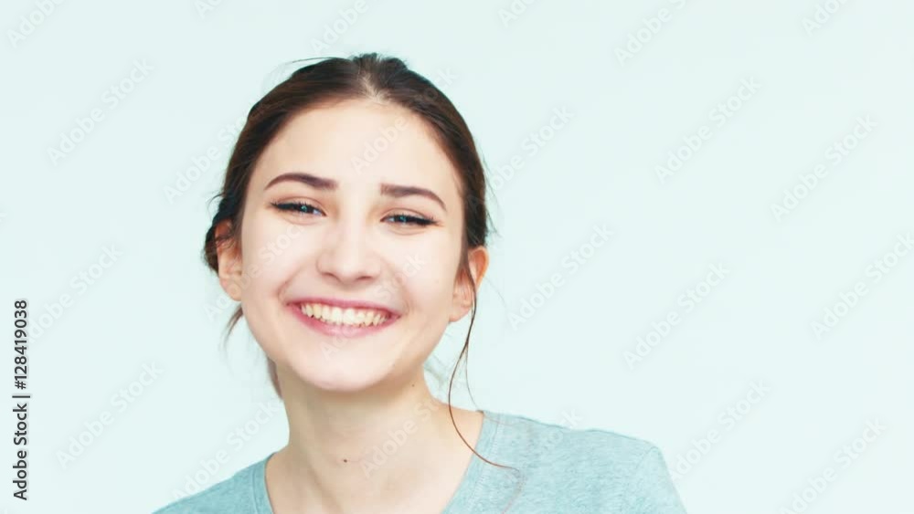 Portrait girl 14 years old teenager on the white background. Teen laughing at camera Portrait girl 14 years old teenager on the white background. Teen laughing at camera